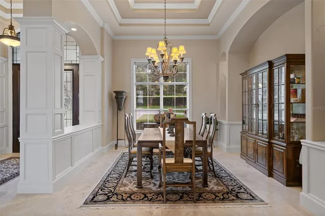 a view of a dining room with furniture and window