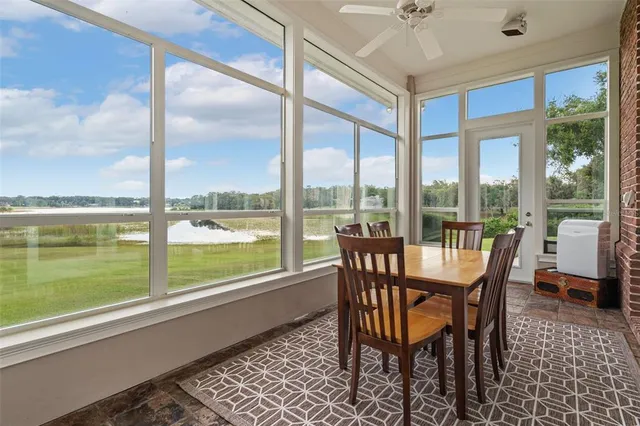 a dining room with furniture and windows