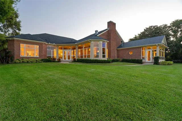 a view of a lake with a house in the background
