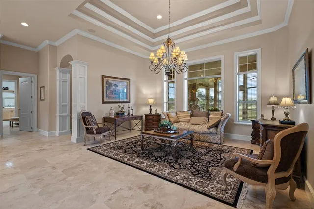 a view of a livingroom with furniture and a chandelier