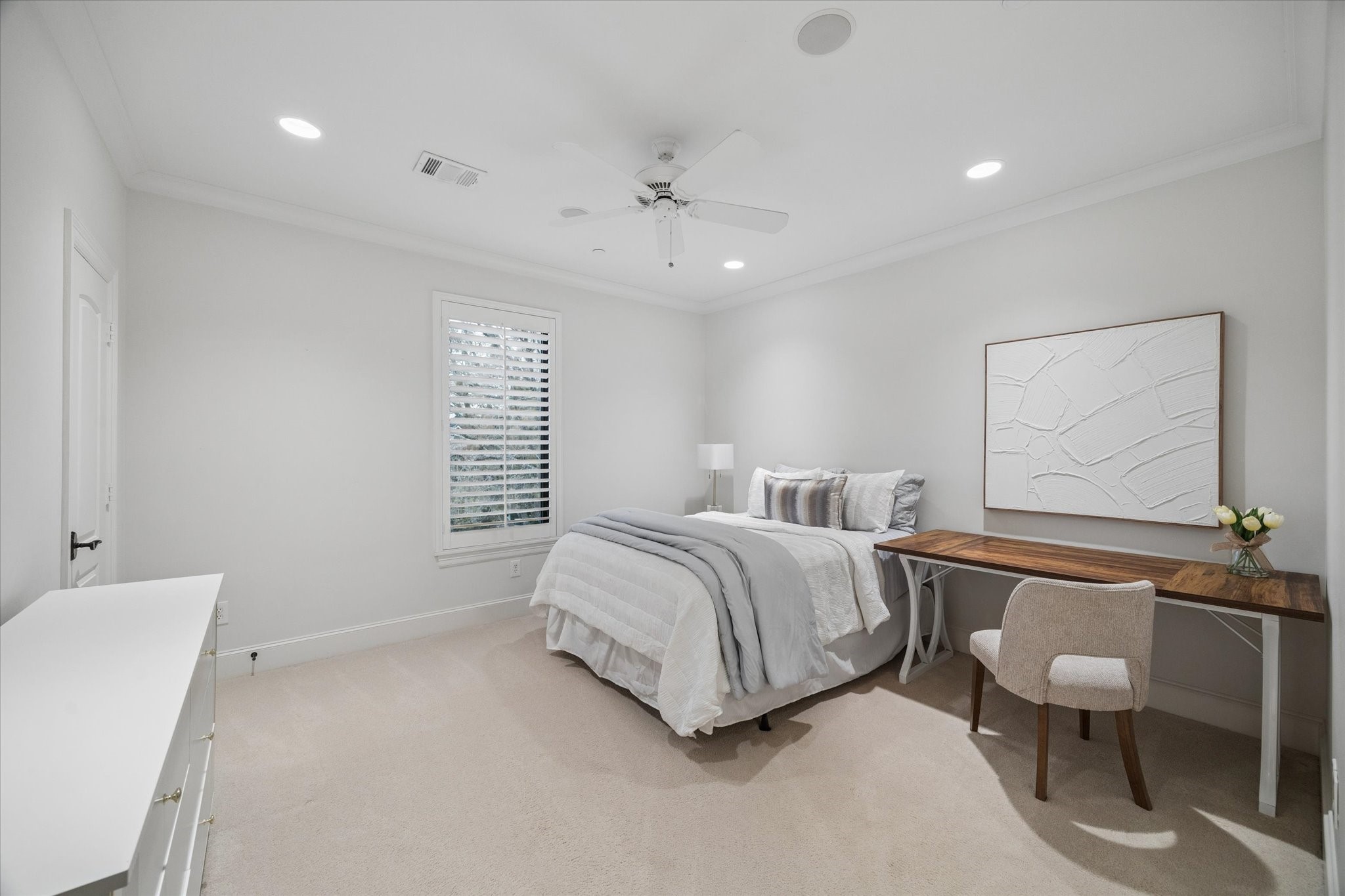 4511 Merrie Lane Bellaire, TX 77401 - Photo 32 of 46 a spacious bedroom with a bed and a furniture