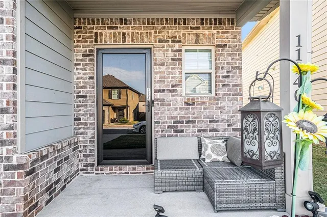 a front view of a house with outdoor space