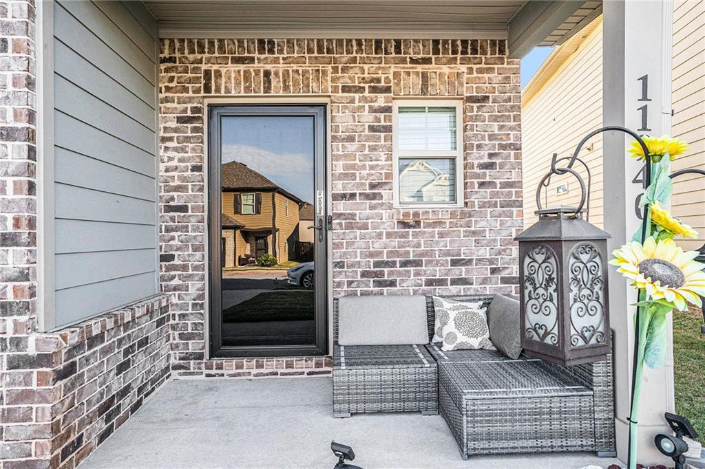 11940 Brightside Parkway Hampton, GA 30228 - Photo 5 of 31 a front view of a house with outdoor space