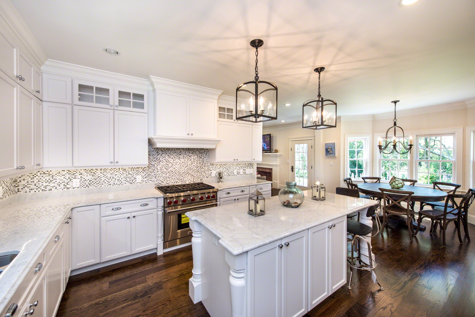 61 Clevelandtown Road Edgartown, MA 02539 - Photo 14 of 43 a view of center kitchen island with stainless steel appliances granite countertop stove and large window
