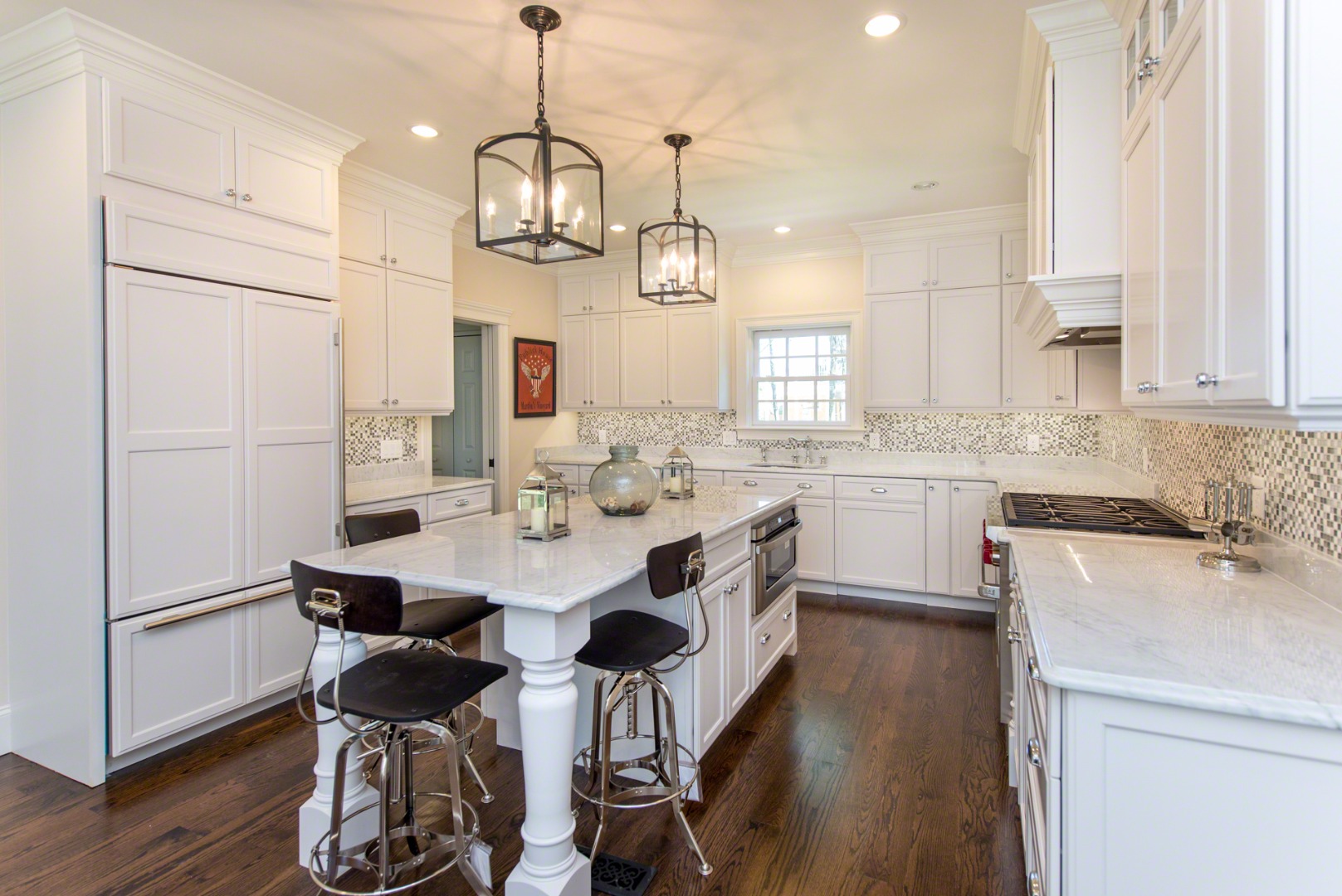 61 Clevelandtown Road Edgartown, MA 02539 - Photo 17 of 43 a kitchen with kitchen island stainless steel appliances a dining table chairs sink and cabinets