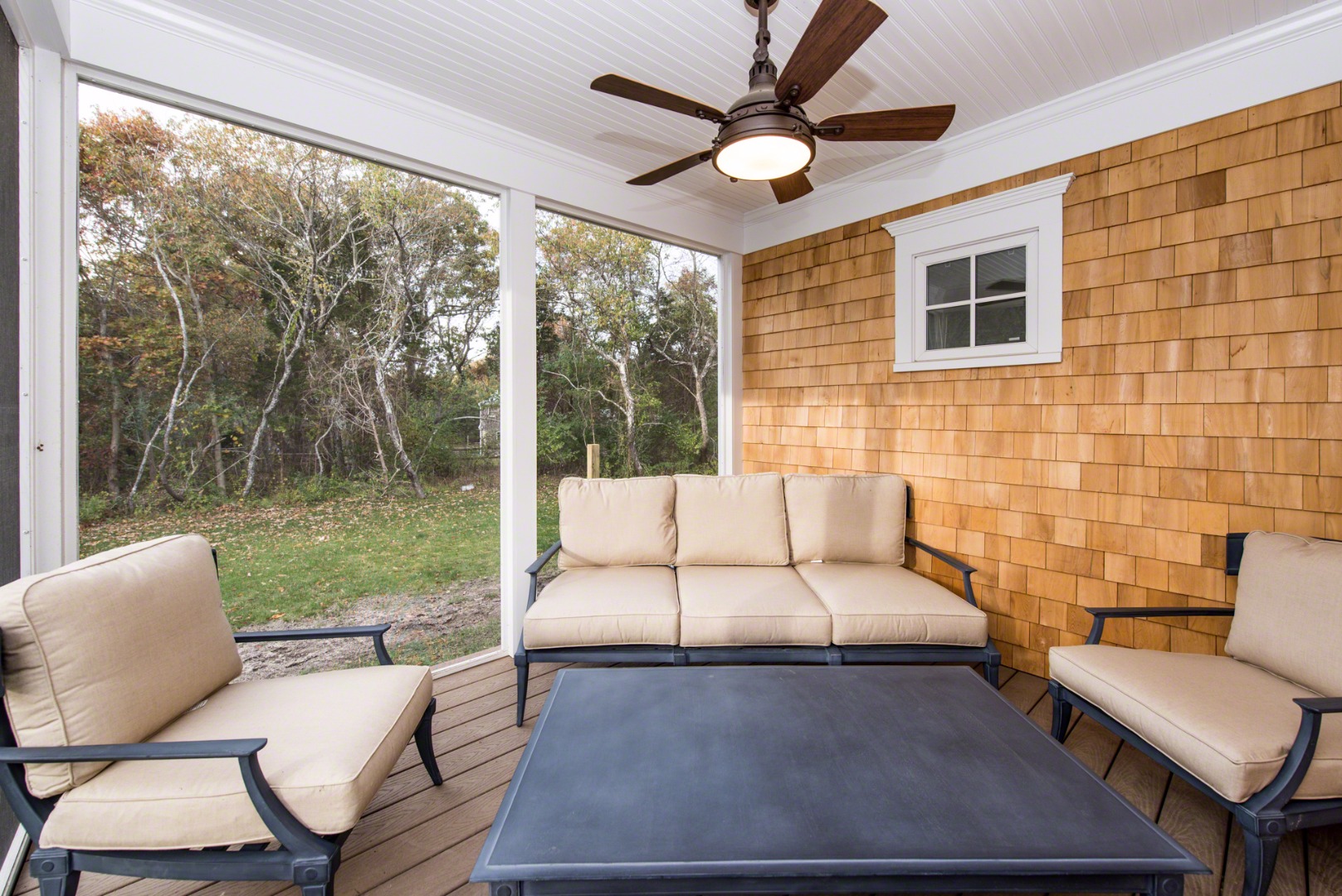 61 Clevelandtown Road Edgartown, MA 02539 - Photo 18 of 43 a living room with furniture and a floor to ceiling window