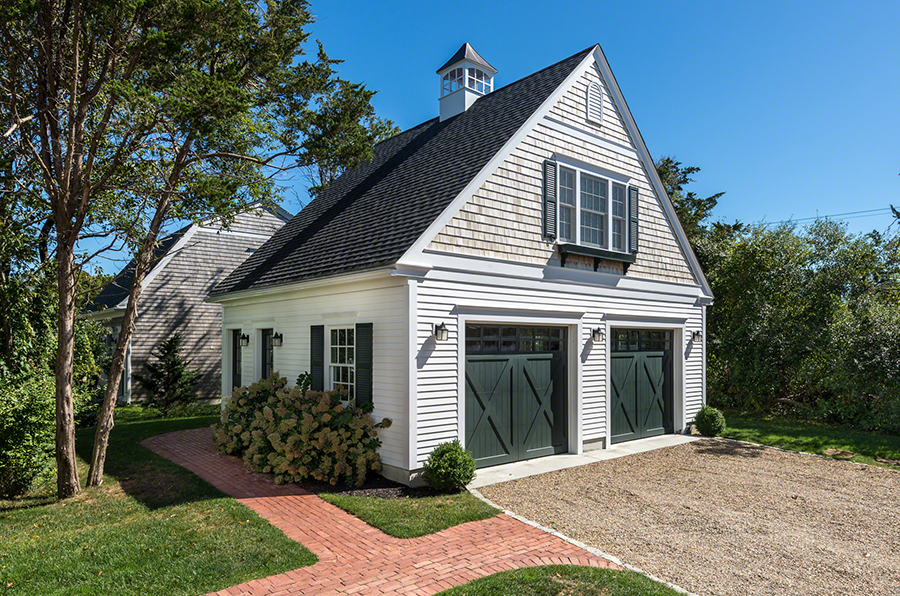 61 Clevelandtown Road Edgartown, MA 02539 - Photo 34 of 43 a view of a white house next to a yard