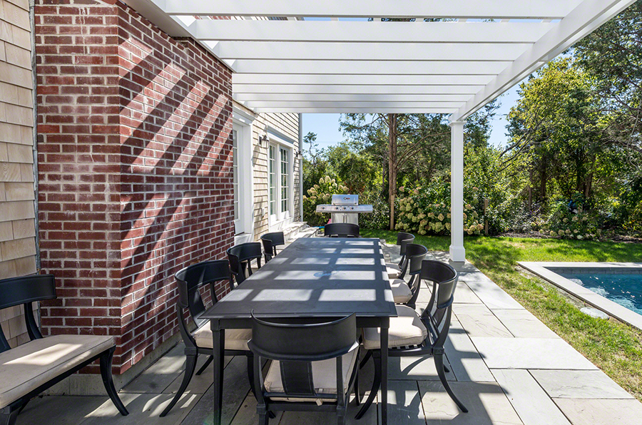 61 Clevelandtown Road Edgartown, MA 02539 - Photo 40 of 43 a view of a patio with a table chairs and backyard