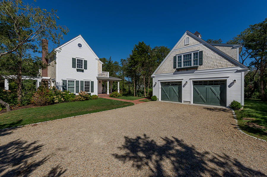 61 Clevelandtown Road Edgartown, MA 02539 - Photo 6 of 43 a front view of a house with a yard and garage