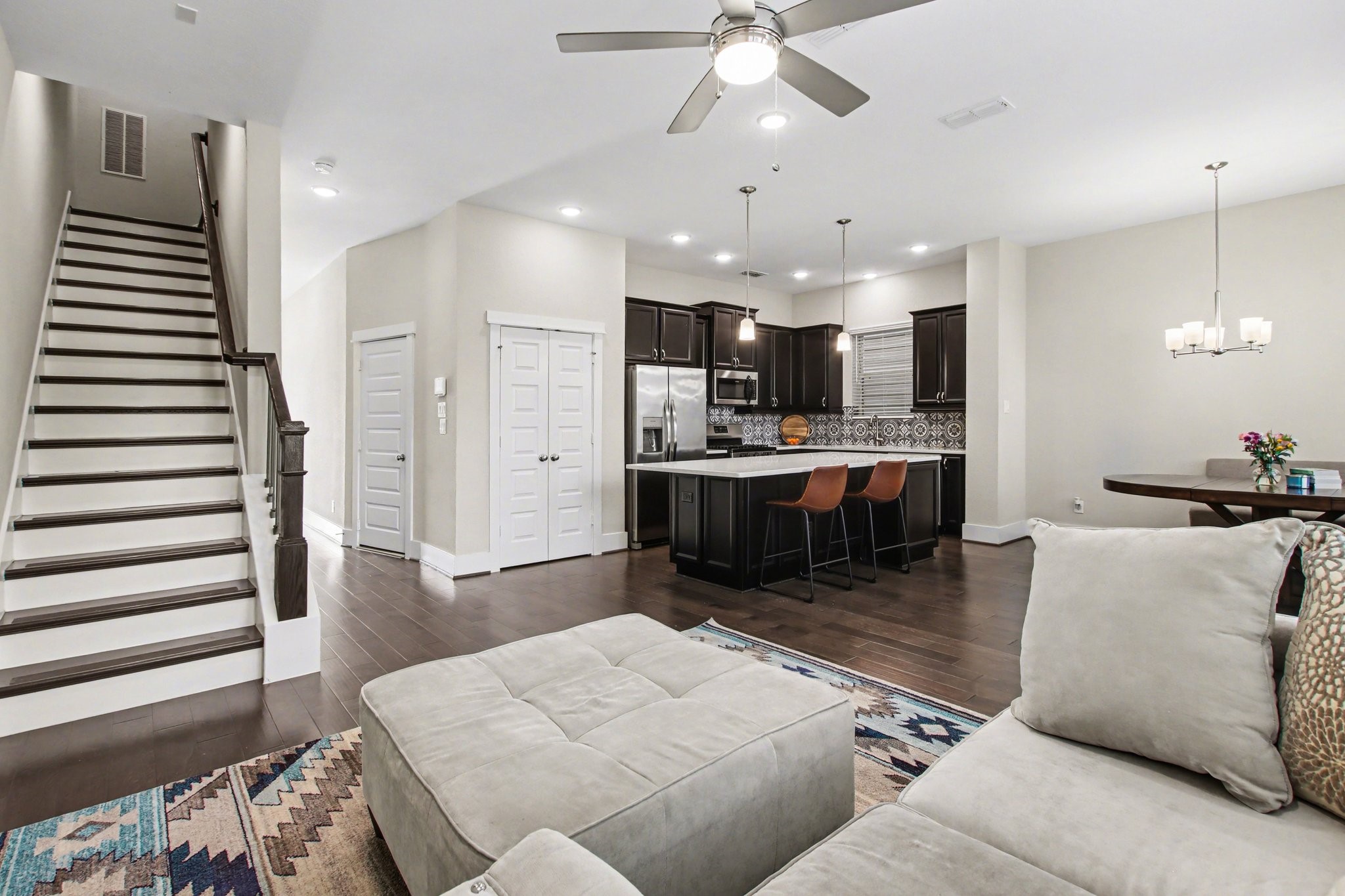 2007 Tarfite Place Houston, TX 77077 - Photo 6 of 24 a living room with stainless steel appliances kitchen island granite countertop furniture and a view of kitchen