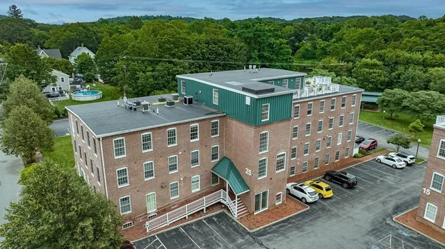 aerial view of a house with a yard