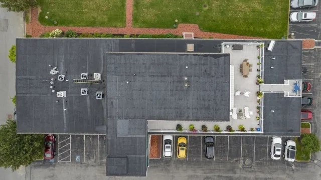 an aerial view of a house with a garden