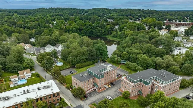 an aerial view of a house with a yard