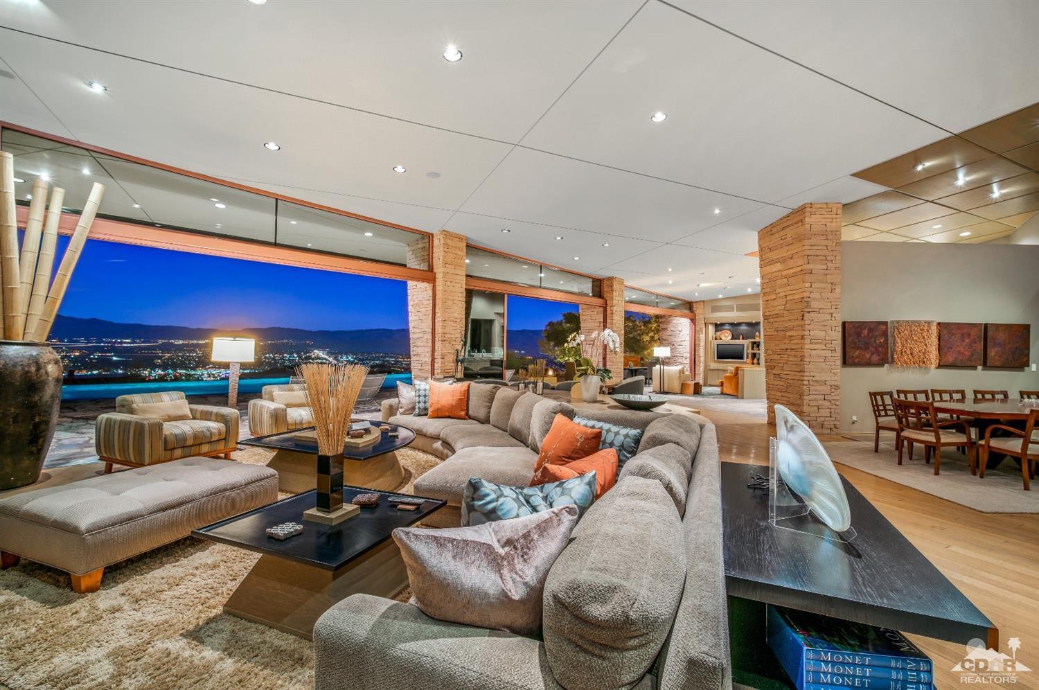 a living room with furniture a rug and a fireplace