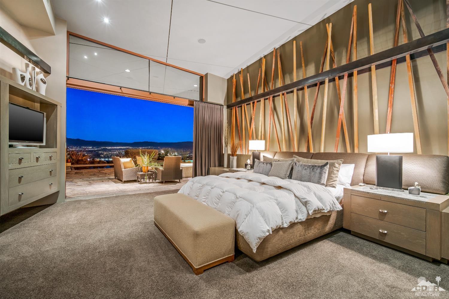 45 Sky Ridge Road Rancho Mirage, CA 92270 - Photo 17 of 90 a spacious bedroom with a bed and a flat screen tv