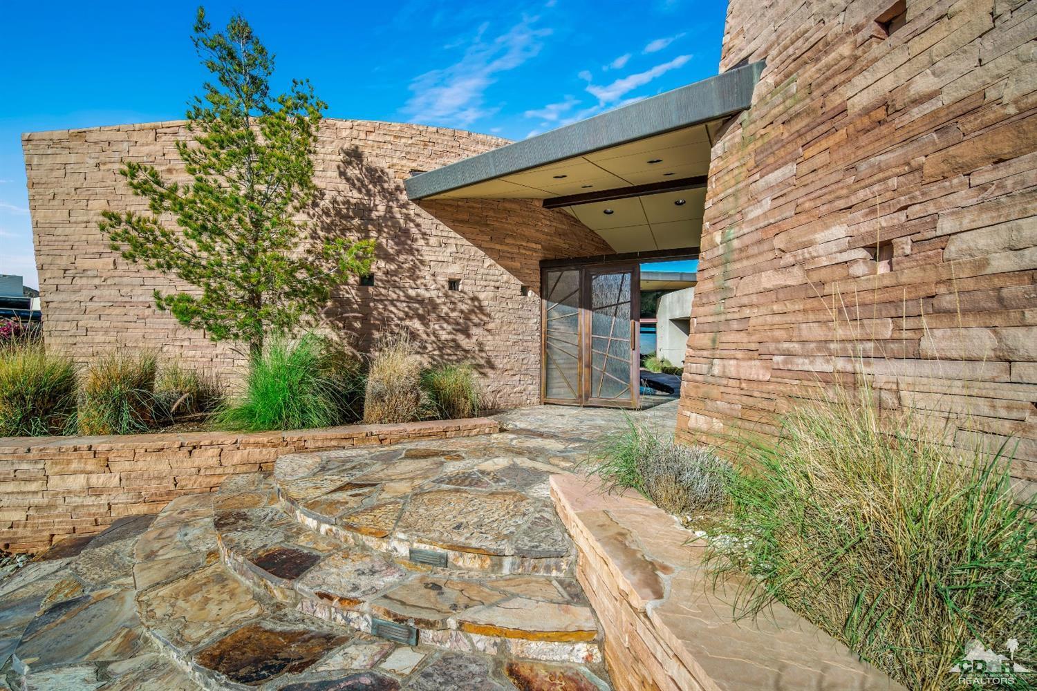 45 Sky Ridge Road Rancho Mirage, CA 92270 - Photo 31 of 90 a view of a pathway both side of building