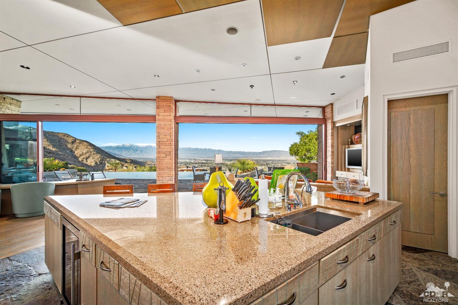 45 Sky Ridge Road Rancho Mirage, CA 92270 - Photo 54 of 90 a kitchen with stainless steel appliances a sink and a large window