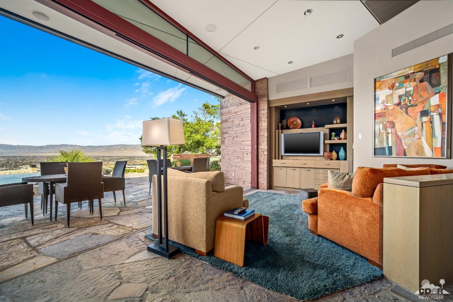 45 Sky Ridge Road Rancho Mirage, CA 92270 - Photo 56 of 90 a living room with furniture and a flat screen tv
