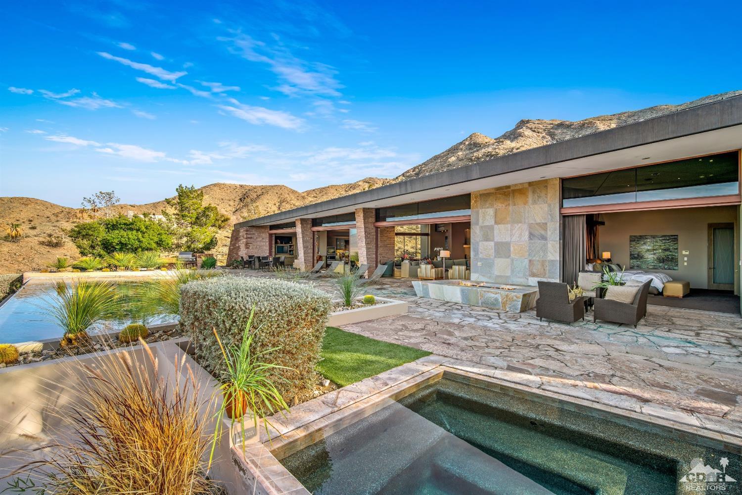 45 Sky Ridge Road Rancho Mirage, CA 92270 - Photo 57 of 90 a view of house with swimming pool and outdoor seating