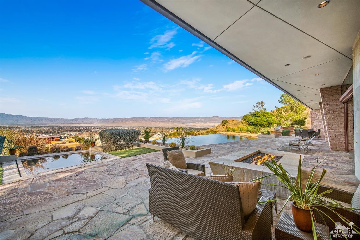 45 Sky Ridge Road Rancho Mirage, CA 92270 - Photo 58 of 90 a view of a swimming pool with outdoor seating space