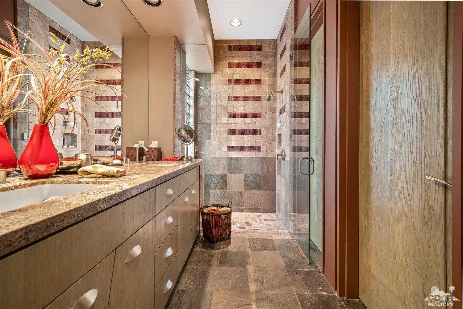 45 Sky Ridge Road Rancho Mirage, CA 92270 - Photo 69 of 90 a bathroom with a granite countertop shower and a sink