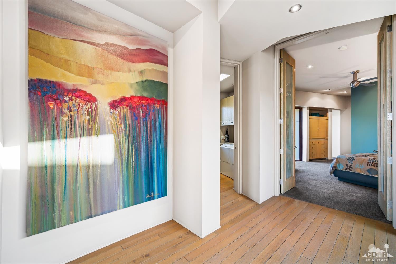 45 Sky Ridge Road Rancho Mirage, CA 92270 - Photo 70 of 90 a view of a bedroom with wooden floor and windows