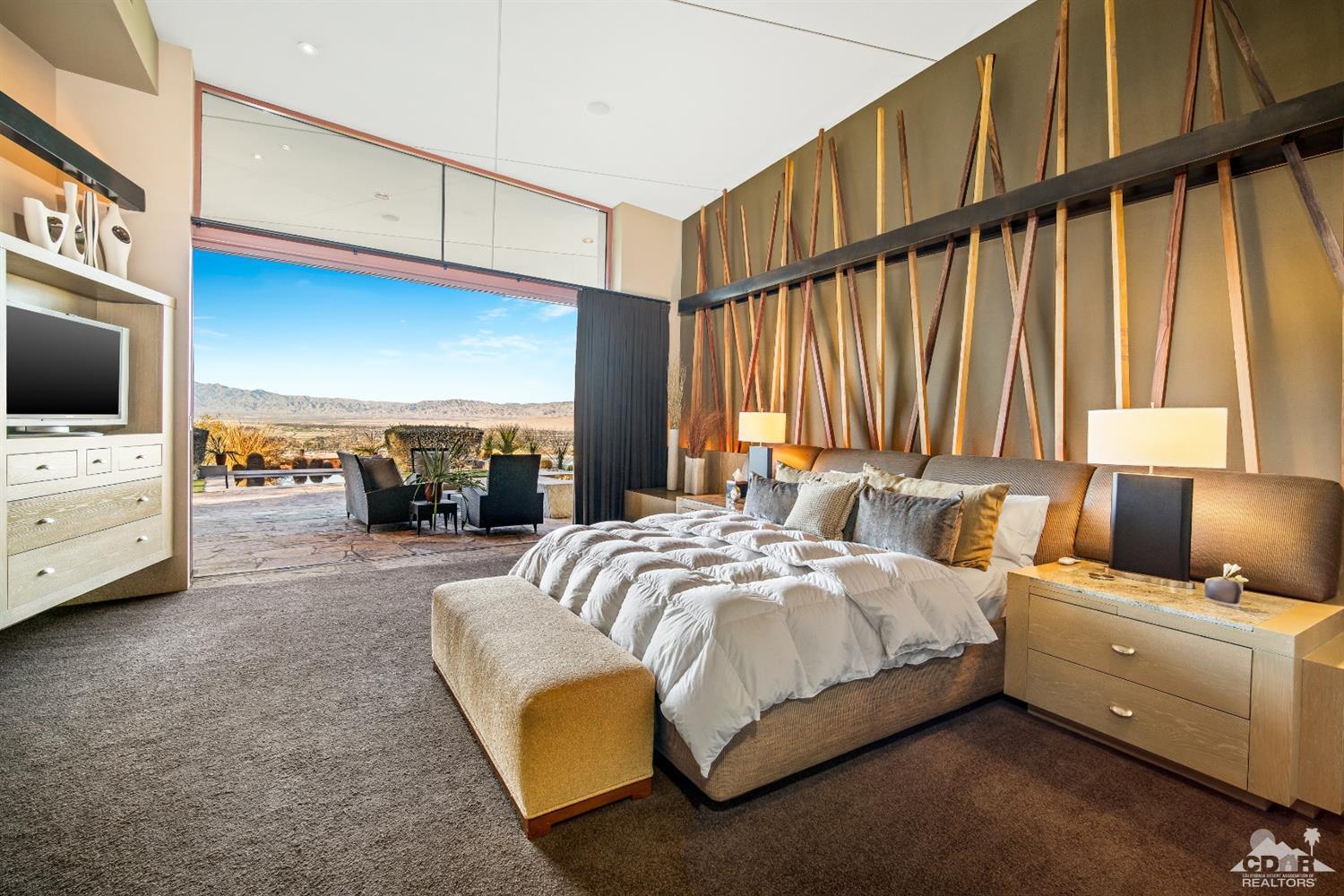 45 Sky Ridge Road Rancho Mirage, CA 92270 - Photo 74 of 90 a bed room with a bed and a television