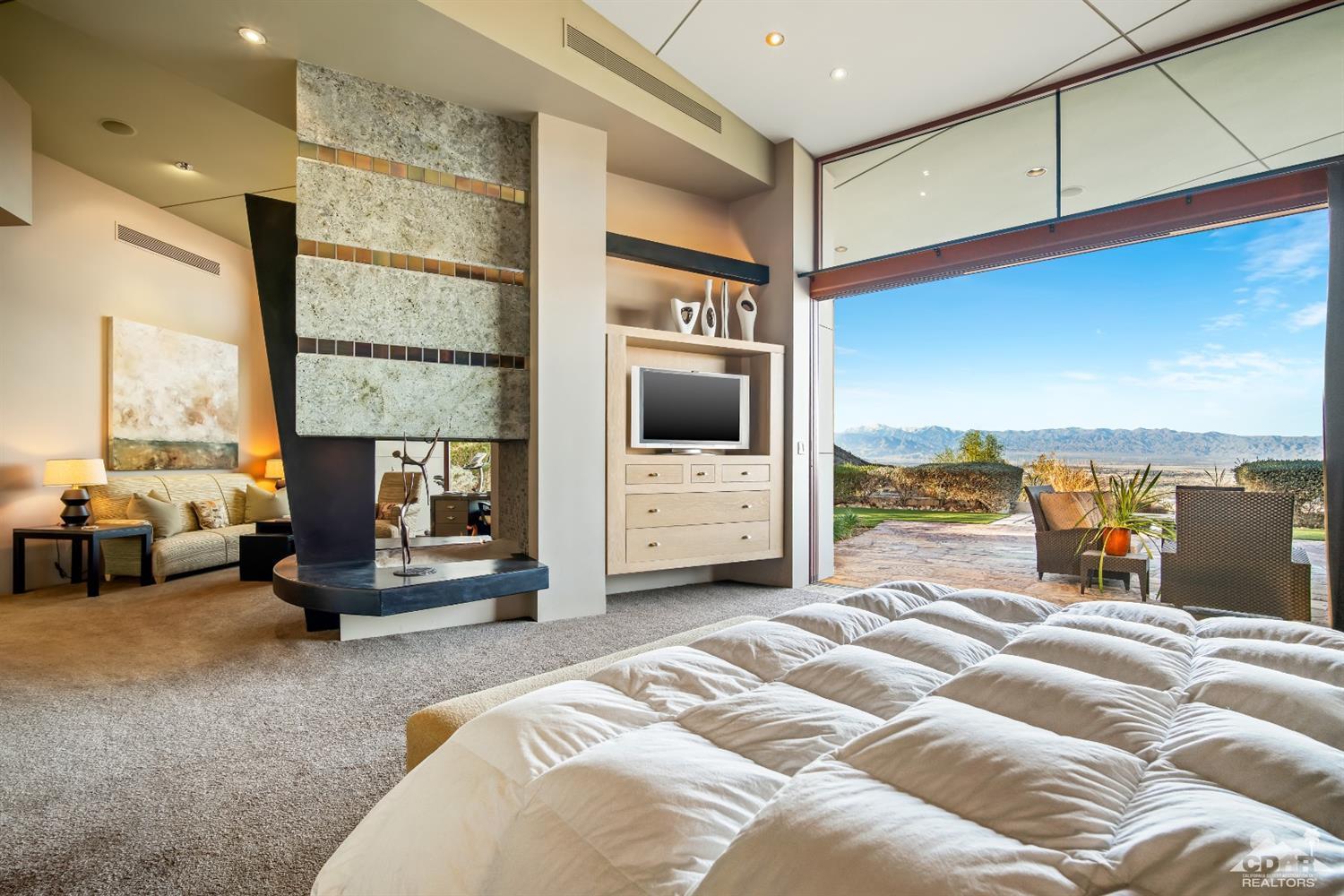 45 Sky Ridge Road Rancho Mirage, CA 92270 - Photo 75 of 90 a bedroom with furniture and a large window