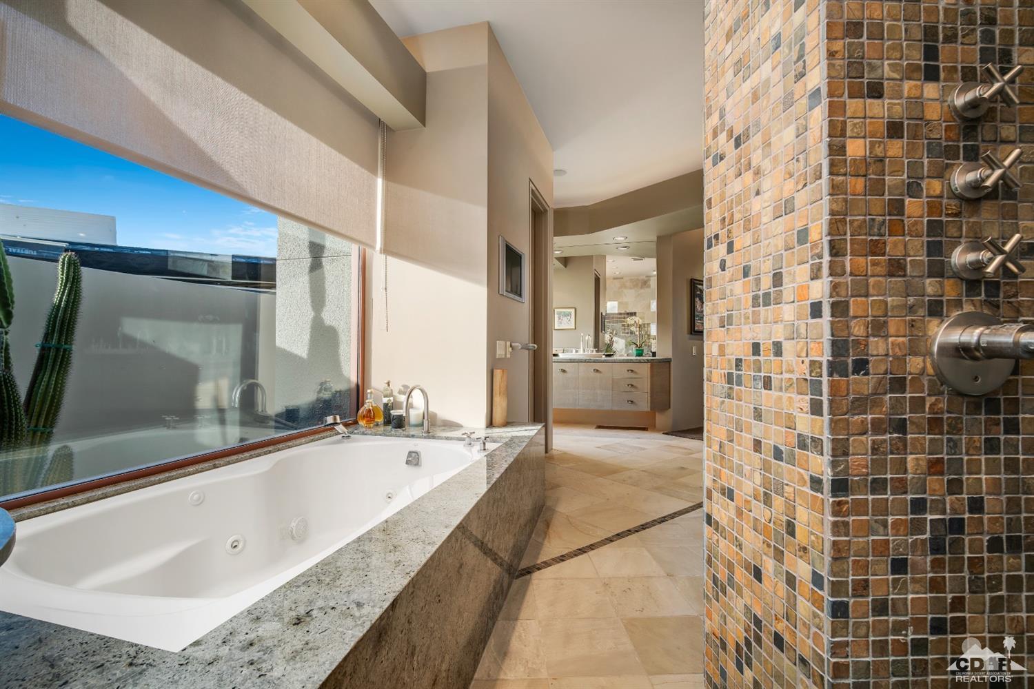 45 Sky Ridge Road Rancho Mirage, CA 92270 - Photo 79 of 90 a bathroom with a bathtub and a sink