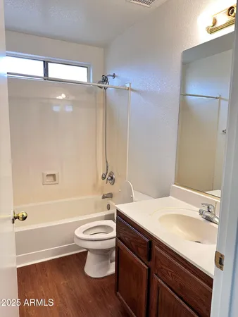 a bathroom with a sink a toilet and a bathtub