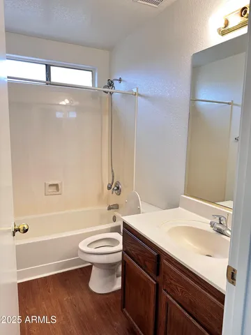 a bathroom with a sink a toilet and a bathtub