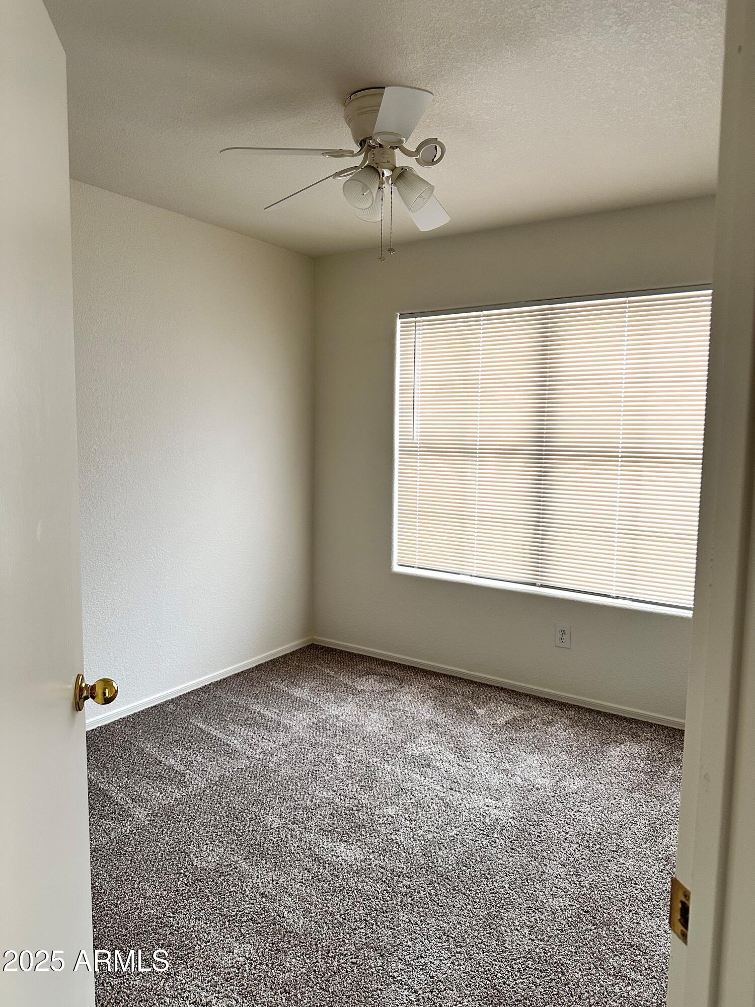 1782 East Del Rio Street Gilbert, AZ 85295 - Photo 18 of 23 an empty room with windows and fan