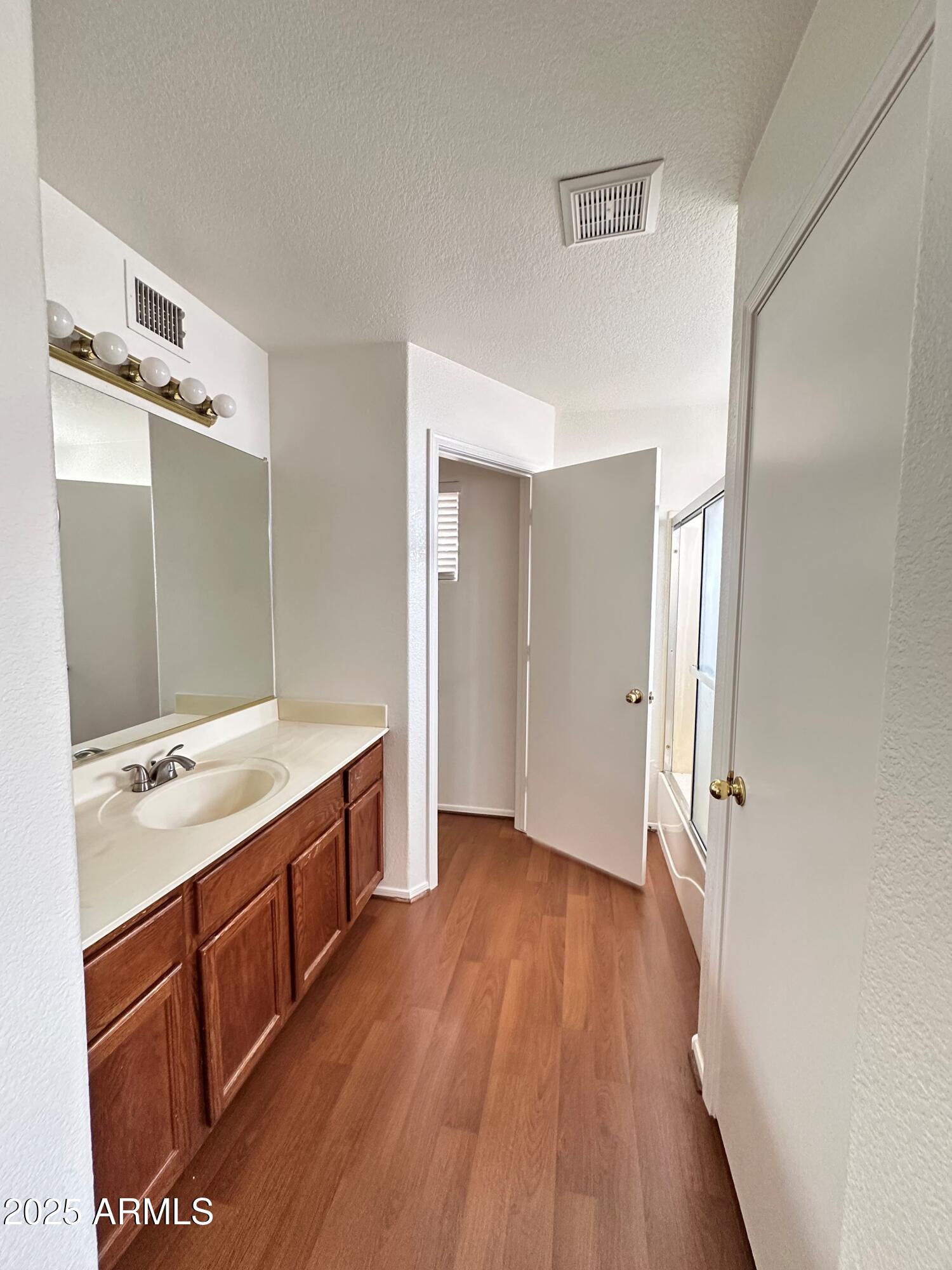 1782 East Del Rio Street Gilbert, AZ 85295 - Photo 21 of 23 a bathroom with a sink a mirror and a shower