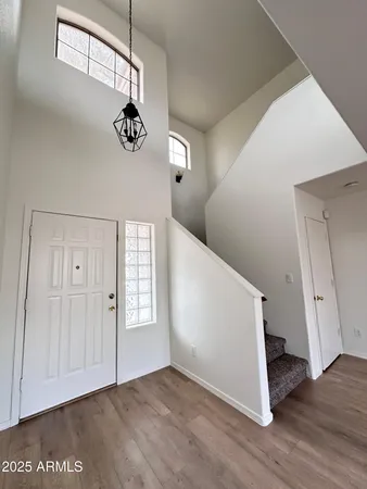 a view of an entryway with wooden floor