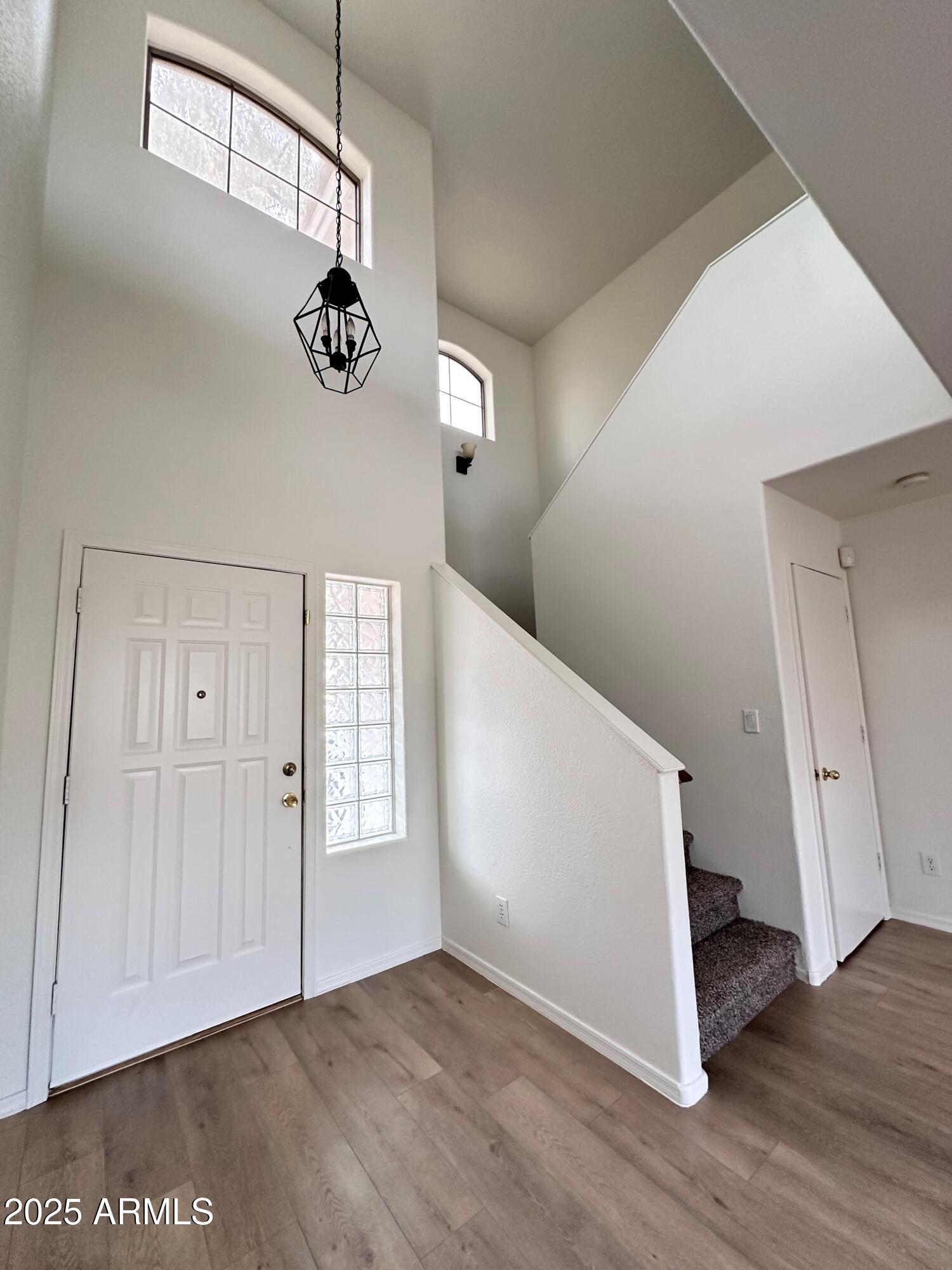 1782 East Del Rio Street Gilbert, AZ 85295 - Photo 3 of 23 a view of an entryway with wooden floor