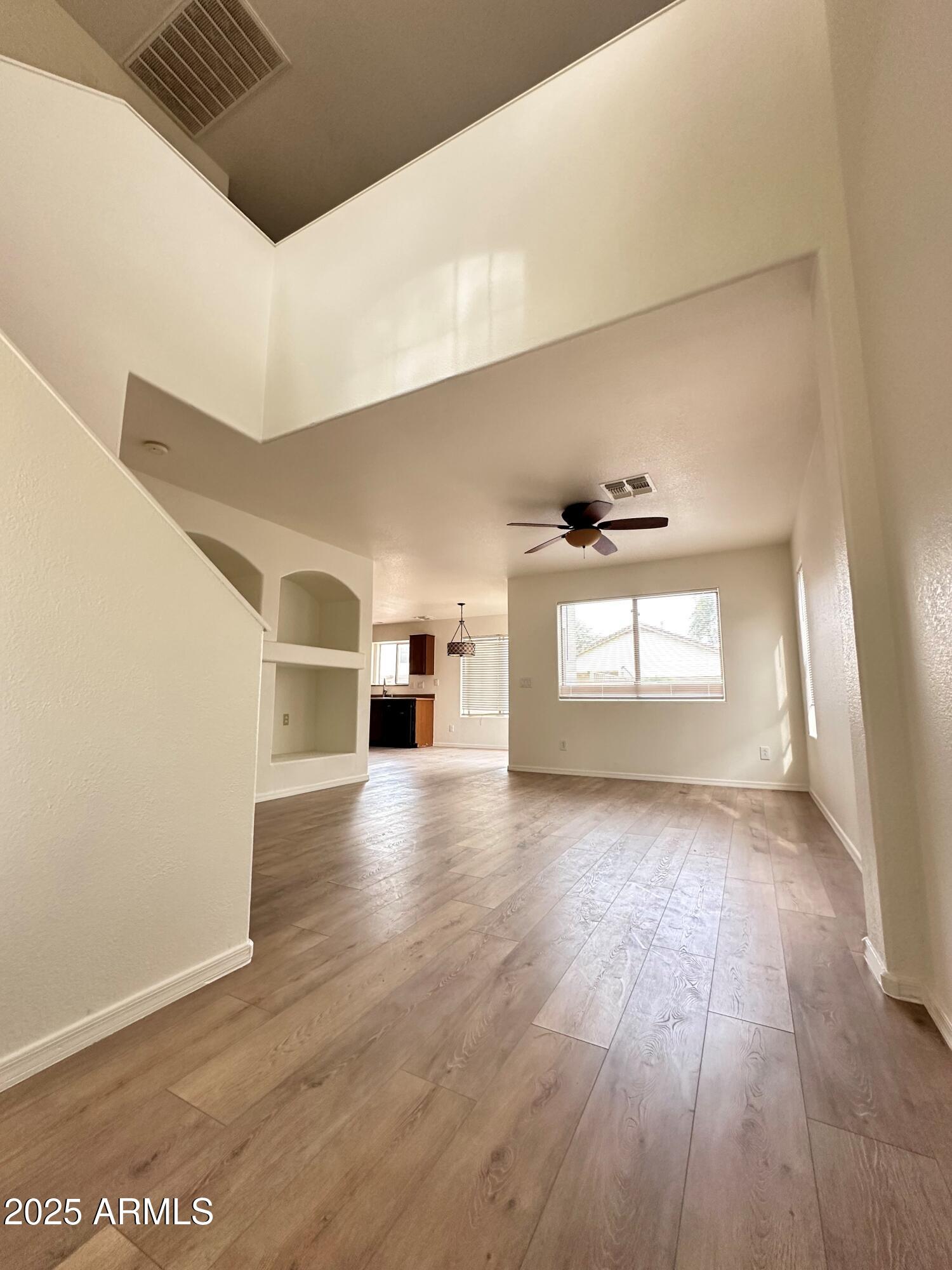 1782 East Del Rio Street Gilbert, AZ 85295 - Photo 6 of 23 a view of a hallway with wooden floor and windows