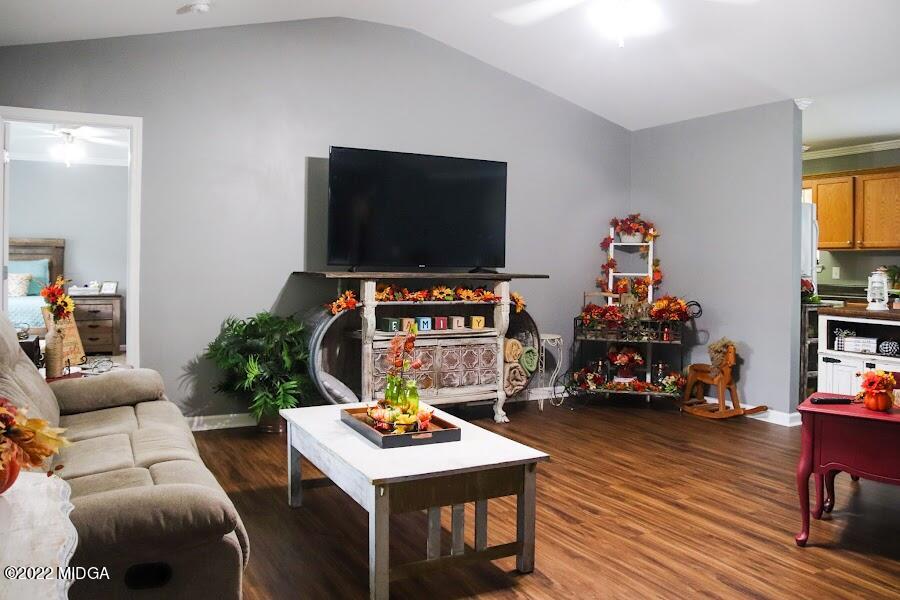 3336 Trotters Ridge Trail Gray, GA 31032 - Photo 4 of 16 a living room with furniture and a flat screen tv