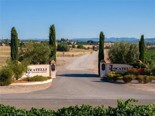 a living room with lots of furniture and a large window