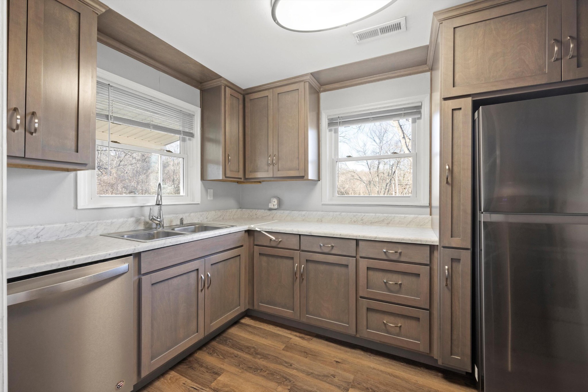 420 West Cloud Springs Road Rossville, GA 30741 - Photo 1 of 16 a kitchen with a sink window and cabinets