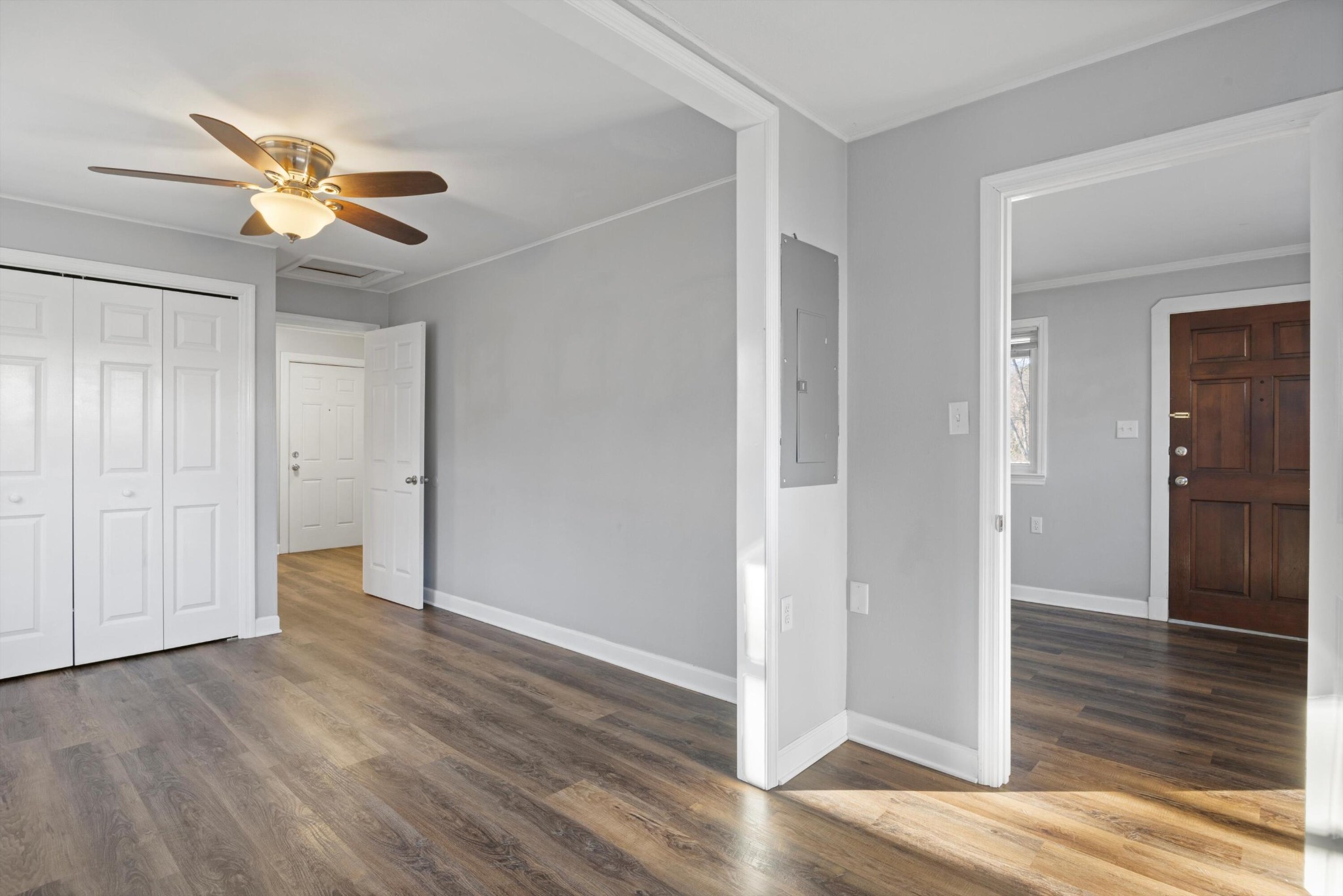 420 West Cloud Springs Road Rossville, GA 30741 - Photo 11 of 16 an empty room with wooden floor a ceiling fan and a window