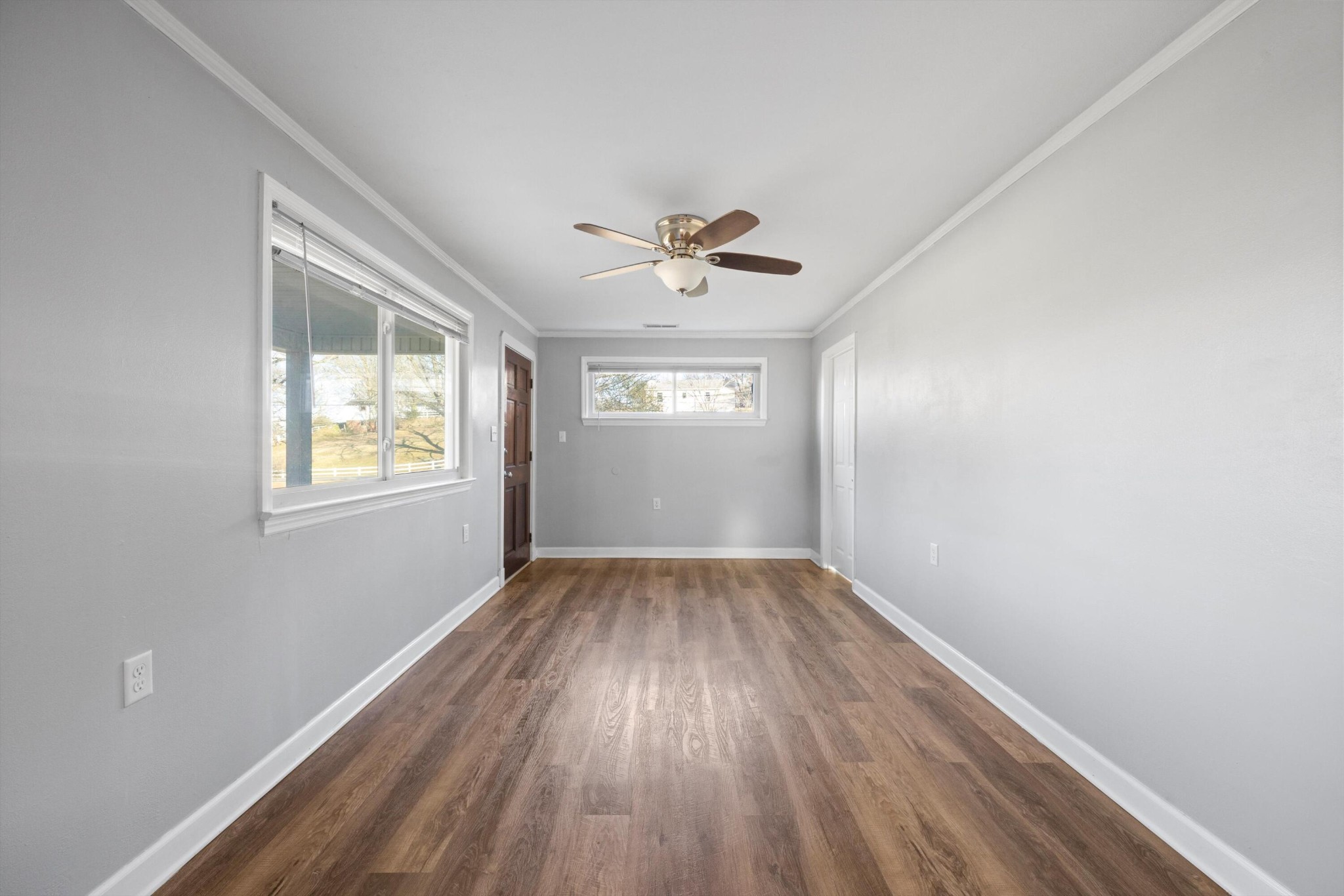 420 West Cloud Springs Road Rossville, GA 30741 - Photo 6 of 16 wooden floor in an empty room with a window
