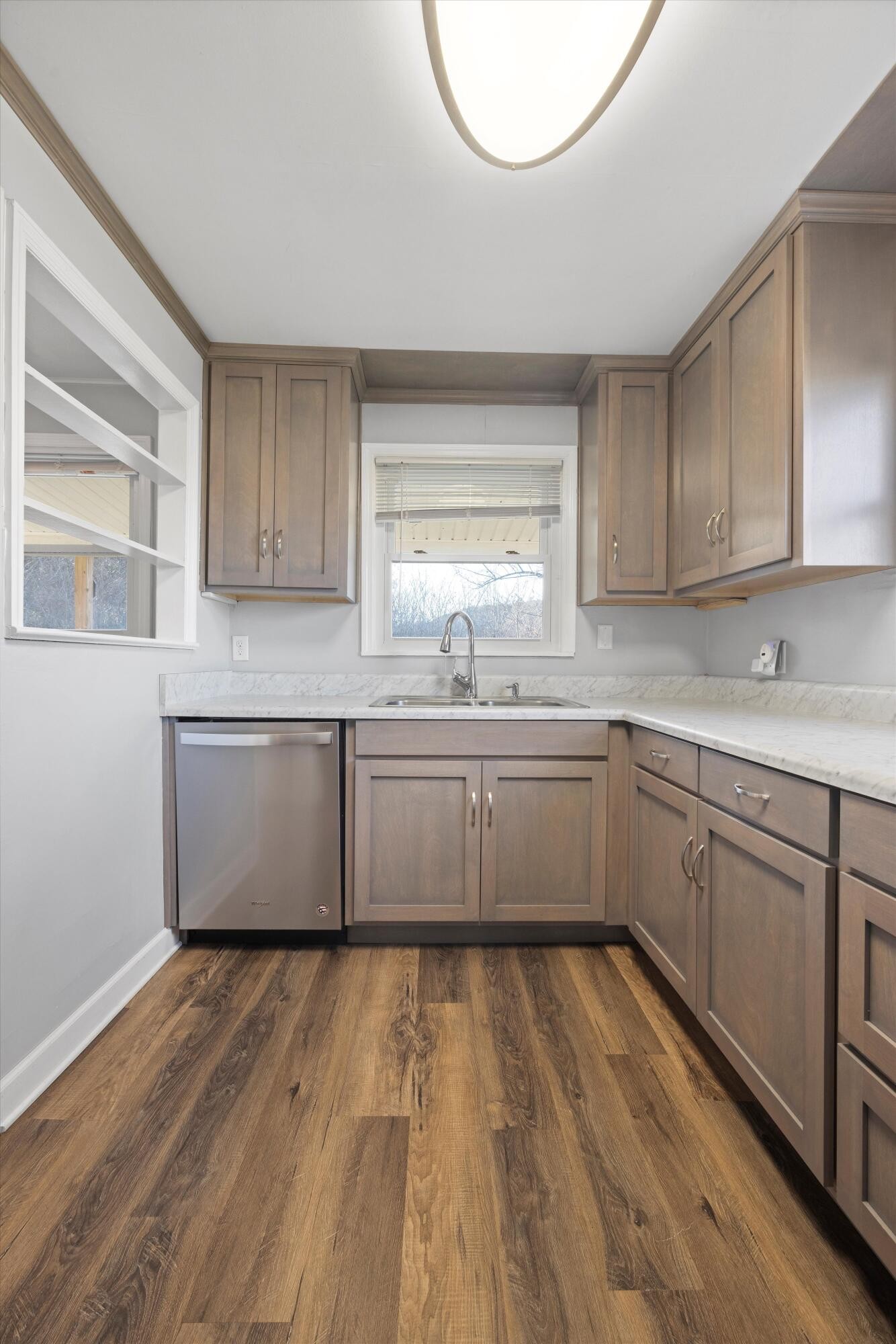 420 West Cloud Springs Road Rossville, GA 30741 - Photo 7 of 16 a kitchen with a sink window and cabinets