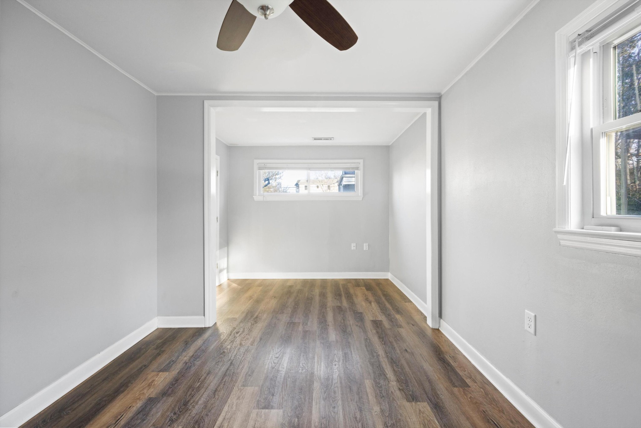 420 West Cloud Springs Road Rossville, GA 30741 - Photo 9 of 16 an empty room with wooden floor cabinet and windows