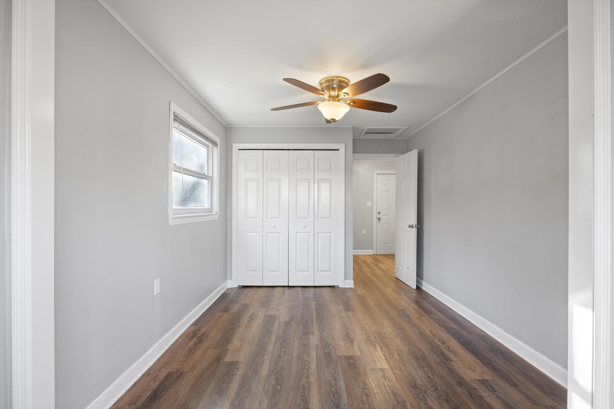 420 West Cloud Springs Road Rossville, GA 30741 - Photo 10 of 16 a view of an empty room with a window and wooden floor