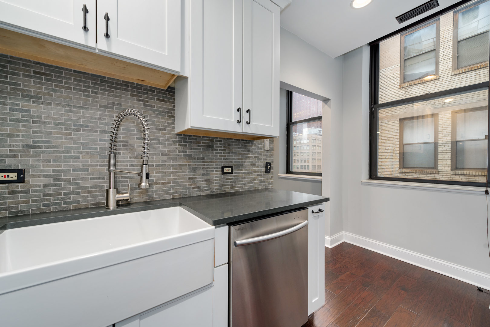 640 South Federal Street, Unit 708 Chicago, IL 60605 - Photo 14 of 20 a bathroom with a granite countertop sink a toilet and bathtub