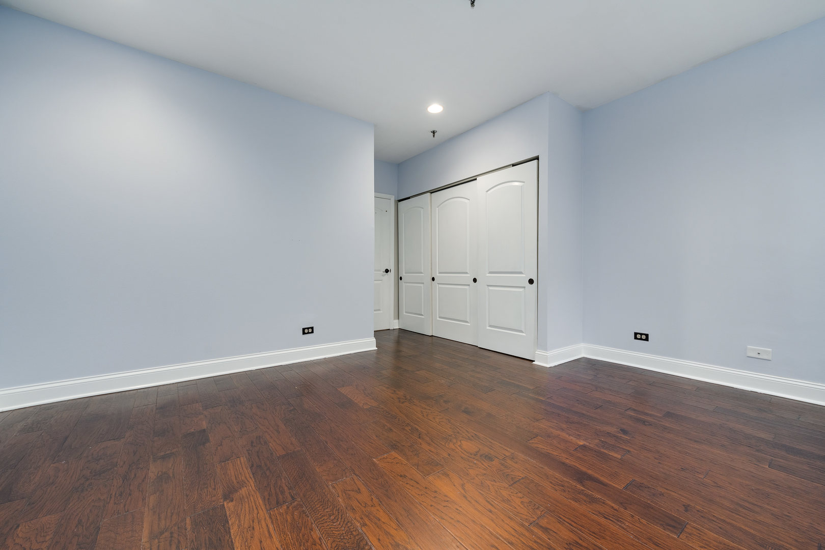 640 South Federal Street, Unit 708 Chicago, IL 60605 - Photo 17 of 20 a view of an empty room with wooden floor