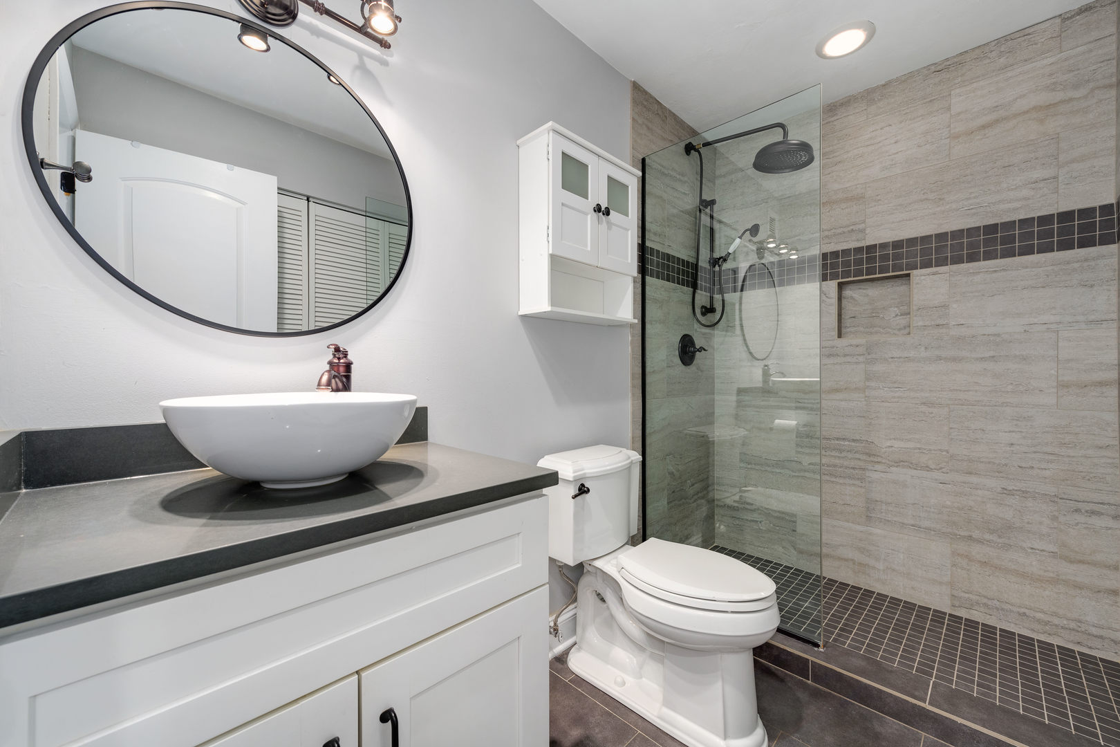 640 South Federal Street, Unit 708 Chicago, IL 60605 - Photo 18 of 20 a bathroom with a toilet a sink and a mirror