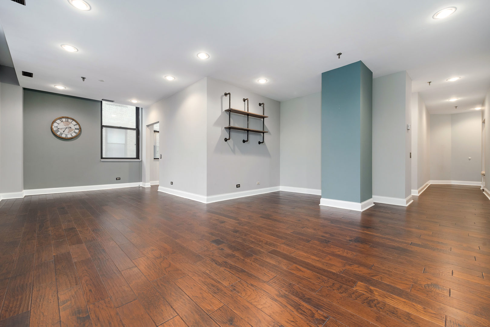 640 South Federal Street, Unit 708 Chicago, IL 60605 - Photo 3 of 20 a view of an empty room with window and wooden floor