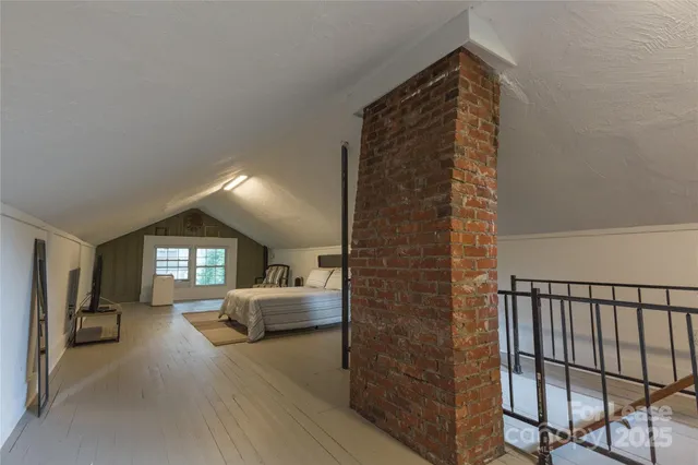 a view of hall way with furniture