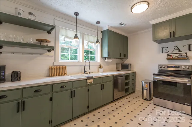a kitchen with sink cabinets and window
